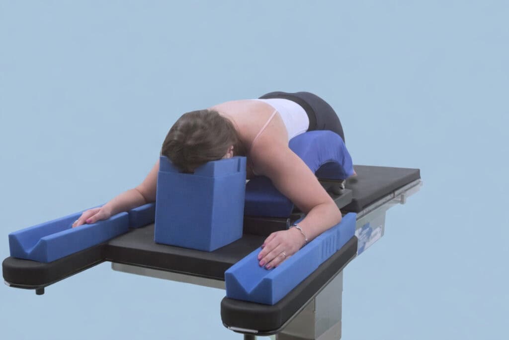 Woman prone on a surgery table